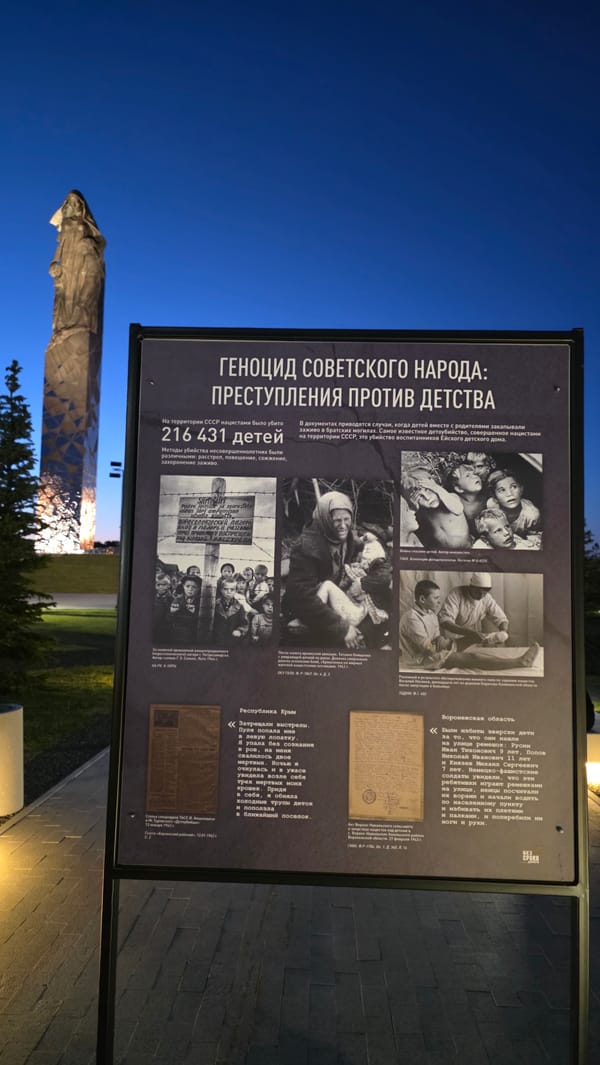 Visitors document WWII memorial and genocide exhibit in Russian village