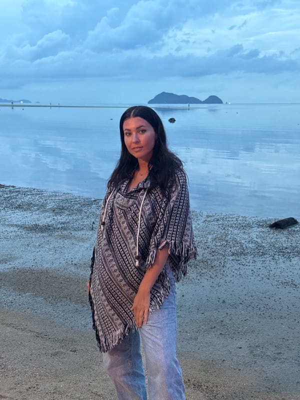 Woman poses at dusk on Thai beach