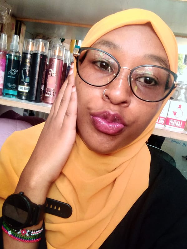 Woman in yellow headscarf photographed in Nyeri, Kenya