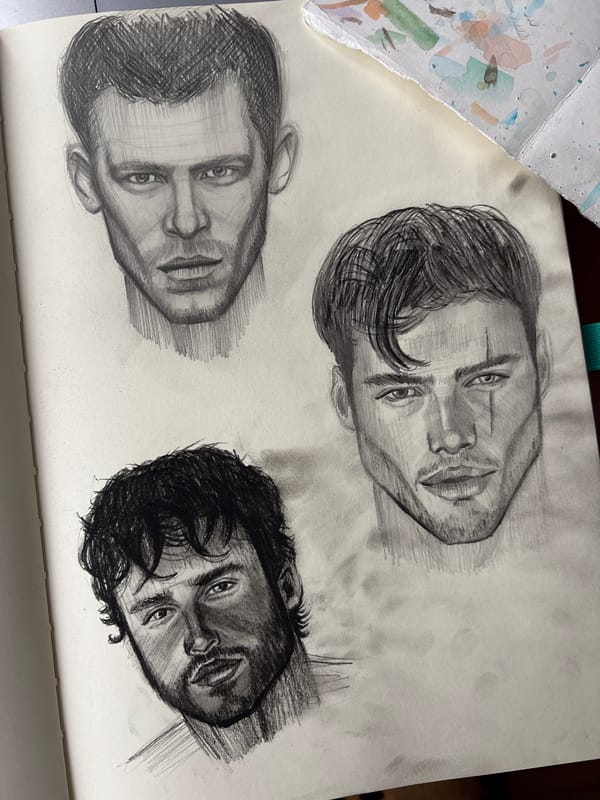 Artist sketches male portraits in Izhevsk sketchbook