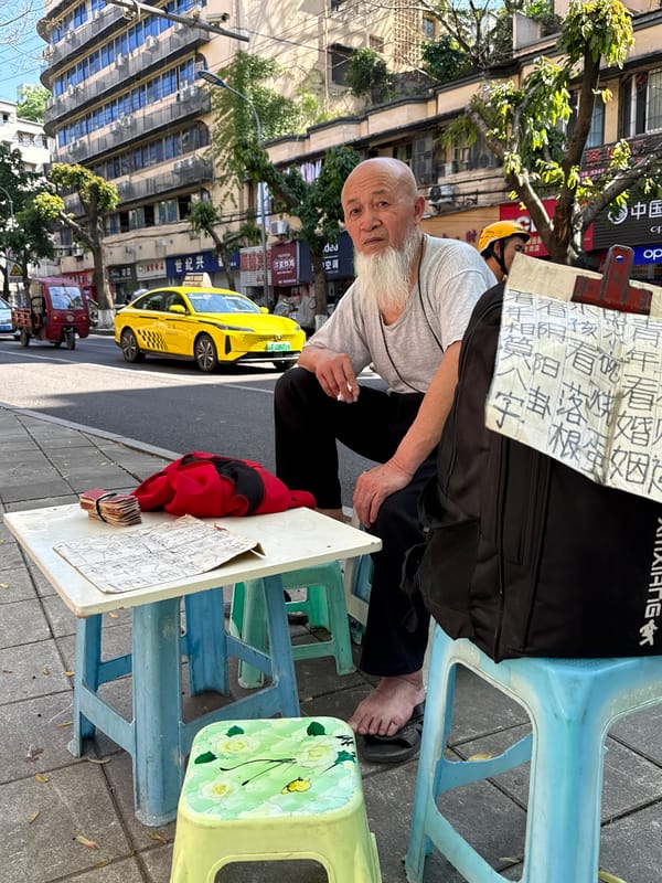 Man conducts sidewalk business in Beibei, China