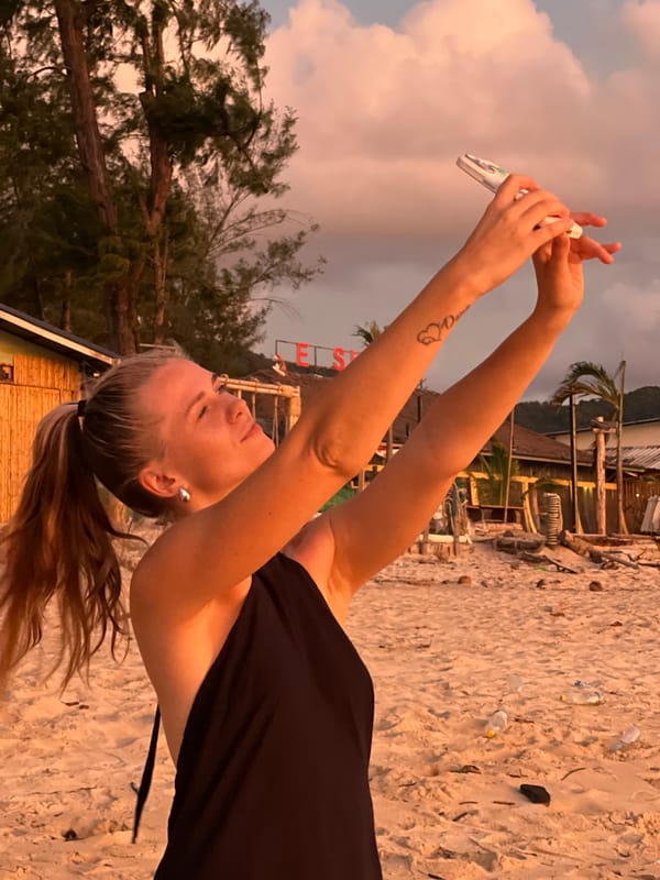 Beach sunset gathering with families, selfies, and golden-hour skies