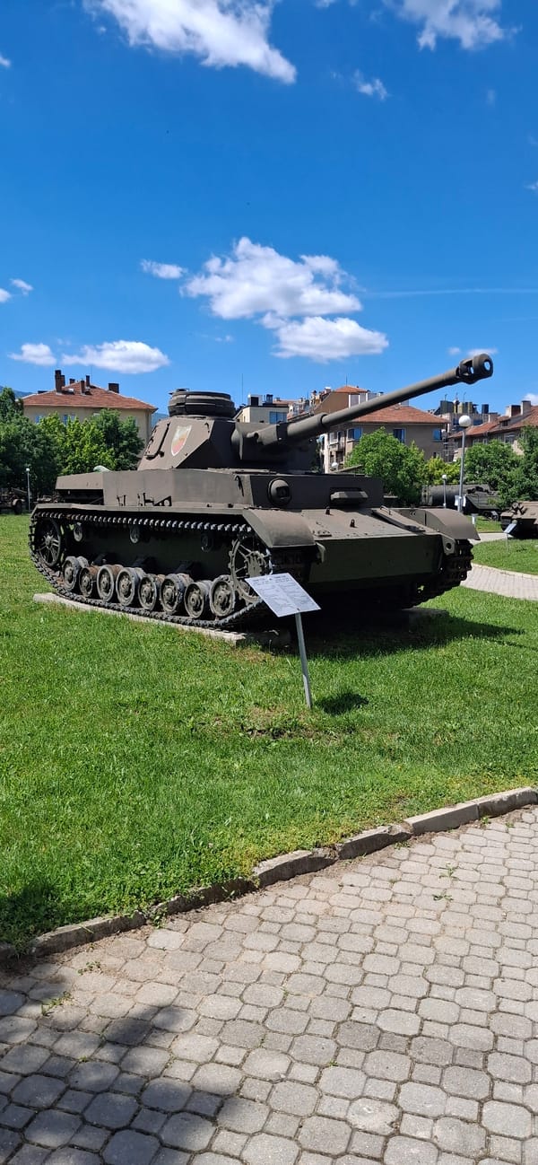 Military vehicles displayed at outdoor exhibit in Sofia