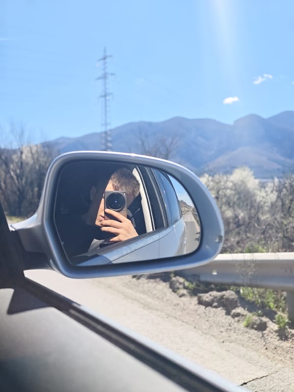 Person takes mirror selfie in car near Vratsa mountains