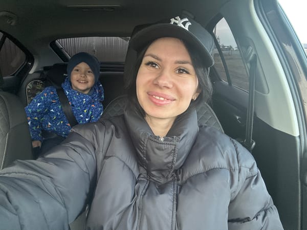Woman and child observed smiling together in car