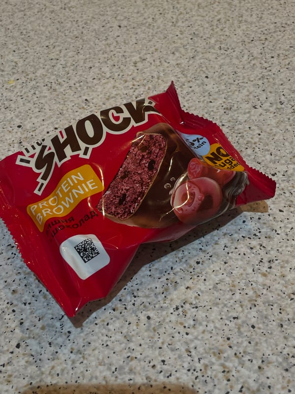 Late-night selfie session with snack package documented in Russia
