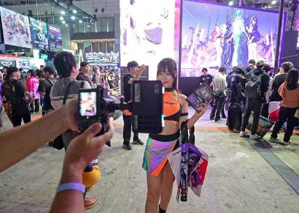 Woman photographed smiling at exhibition hall in Chiba, Japan