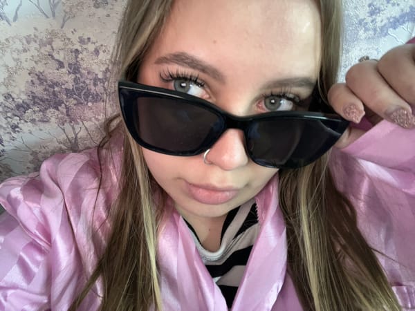 Person documents selfie session with flowers in Novopokrovskaya