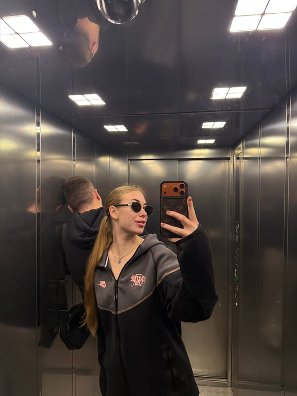 Morning coffee run with a quick elevator selfie stop