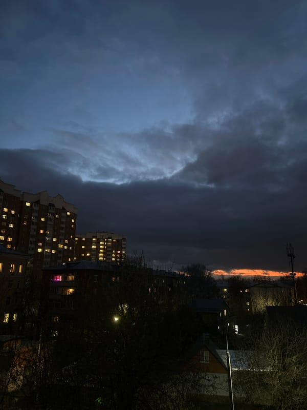 Evening lights illuminate apartment building in Podolsk, Russia
