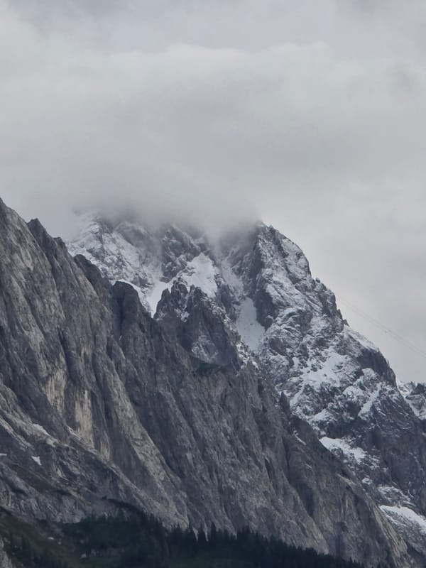 Tourist captures cloudy evening views of snow-capped Zugspitze peak
