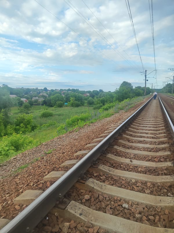 Afternoon at Kharkiv station — tracks, greenery, and slow moments