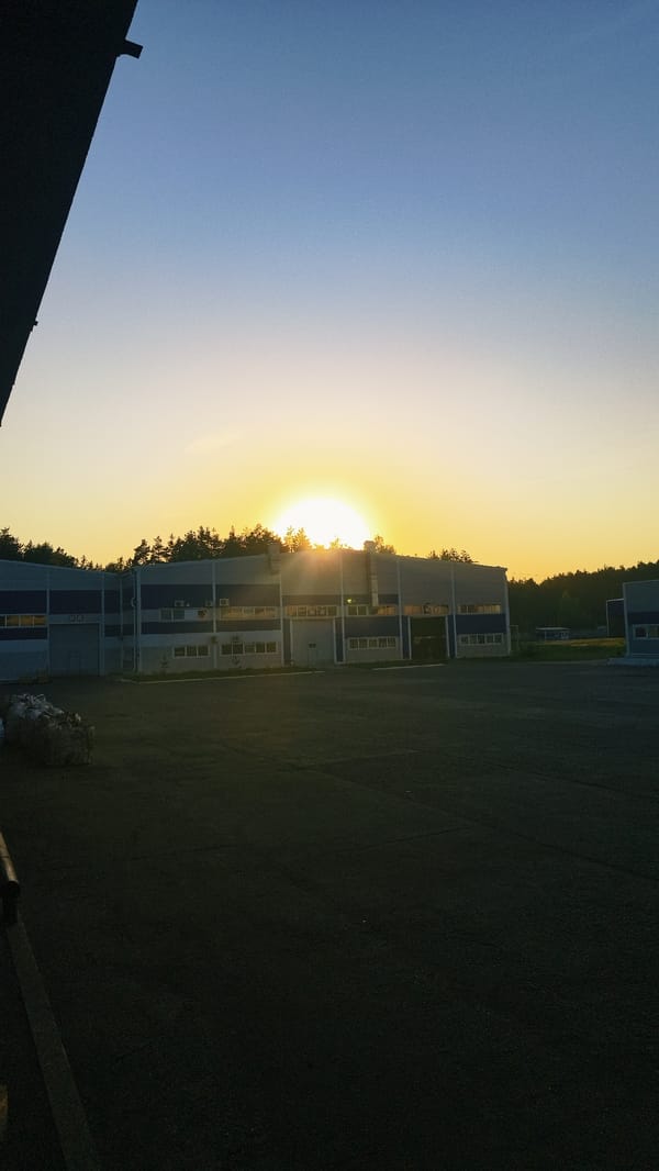 Dusk scene captured in Noviy showing building and vehicle