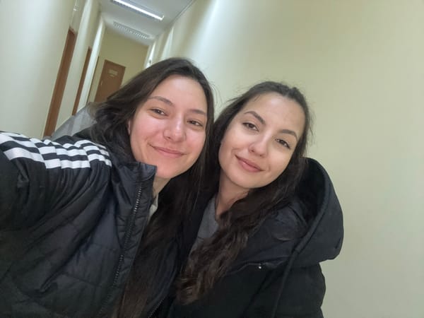 Two women take selfie in indoor hallway in Varna