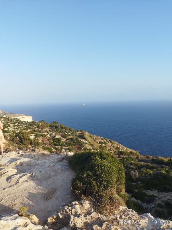 Dingli Cliffs at golden hour: coastline, tower, and chapel