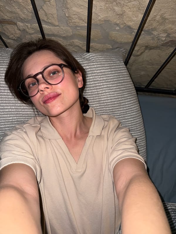 Woman resting on bed observed in Budapest residence