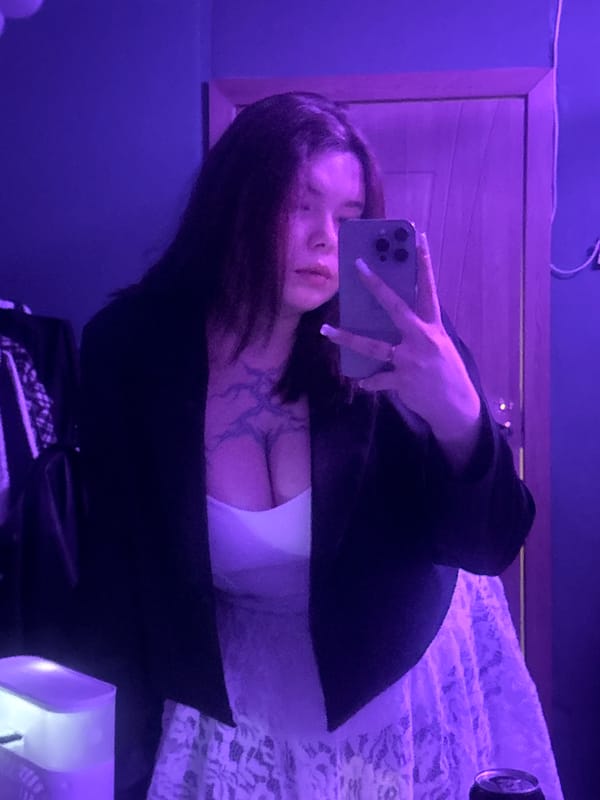 Moody bedroom selfie session under purple and blue lights, Surgut