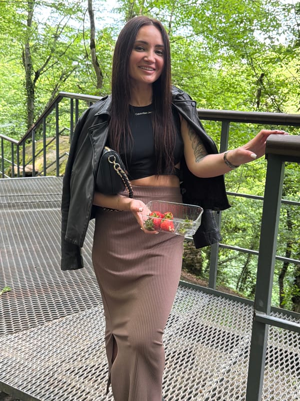 Woman with strawberries spotted on metal bridge in Russian woods