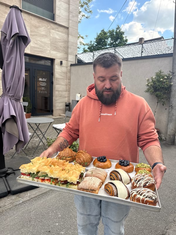 Man displays baked goods on Belgrade street