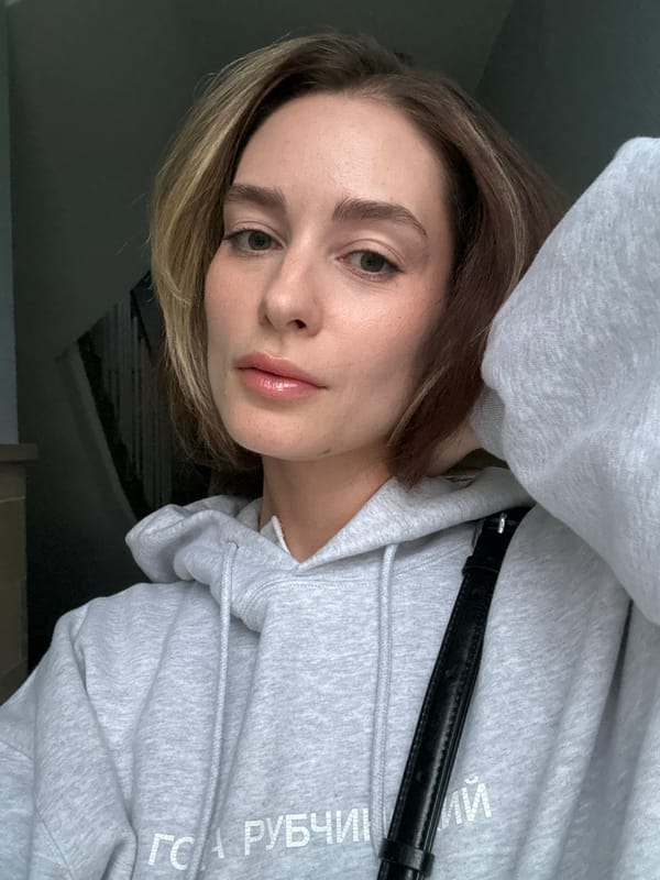 Woman photographed multiple times indoors in Kiel, Germany