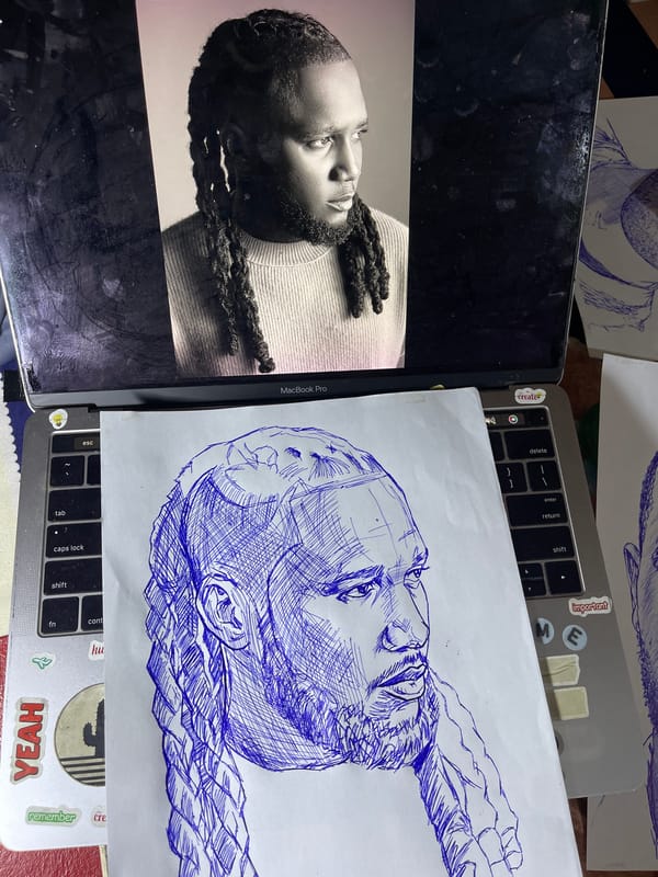 Artist sketches detailed blue ink portrait in Jos, Nigeria