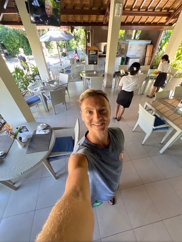 Tourist documents dining experience at Lovina resort in Buleleng