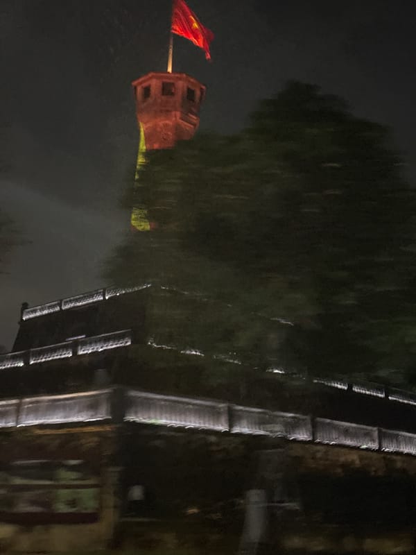 Hanoi at night: Flag Tower and city streets
