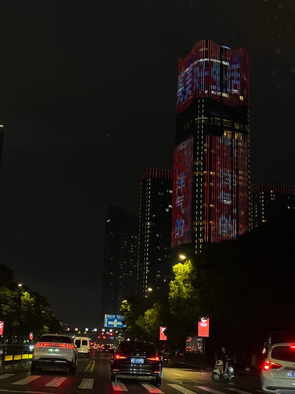 Illuminated high-rise building captured at night in Yiwu, China