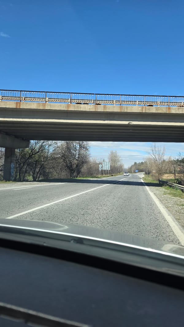 Vehicle drives under concrete overpass in Slatino, Bulgaria