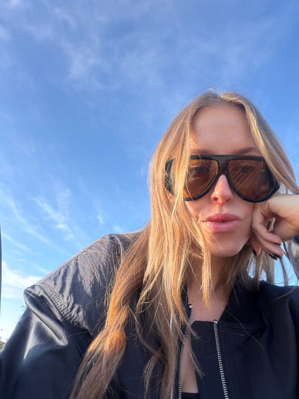 Woman captures selfie with Hollywood Hills landscape views