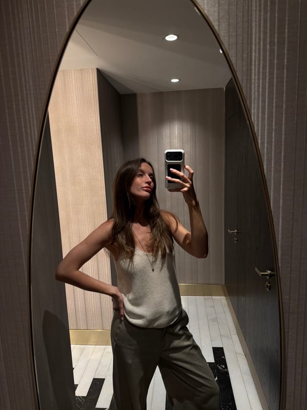 Woman takes bathroom selfies in Budva mirror
