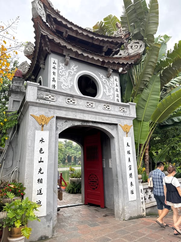 Old Hanoi streets and Hoan Kiem Lake temple on a July morning