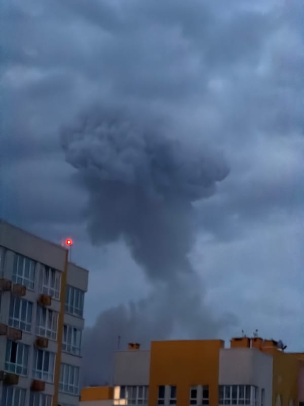 Smoke over Kyiv as residents shelter in underground parking