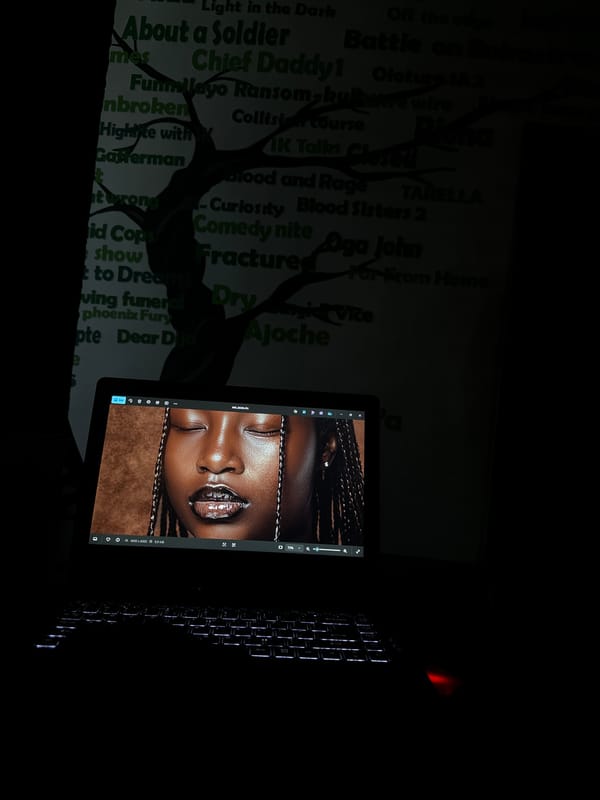 Nighttime laptop presentation session documented in Ikeja, Nigeria