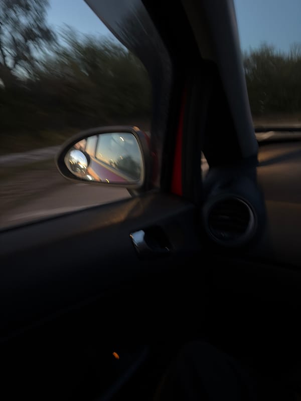 Vehicle interior captured while driving through East Suffolk countryside