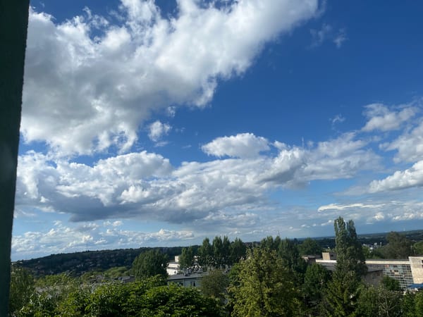Afternoon sky-watching session with dramatic clouds over cityscape