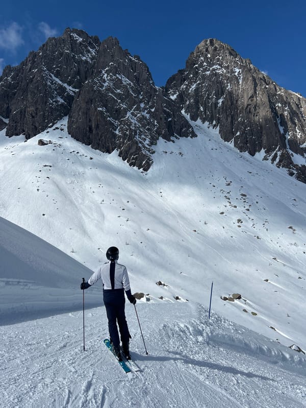 Lone skier documented on alpine slopes during spring afternoon