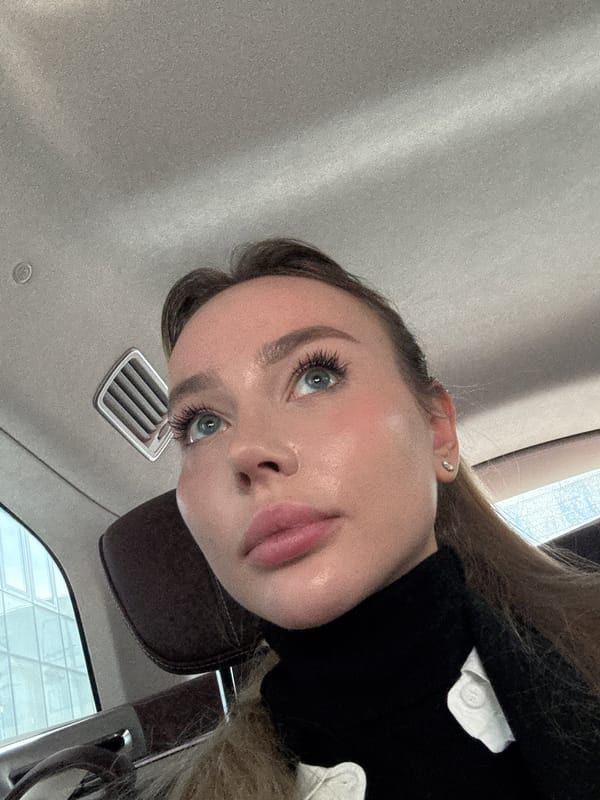 Woman takes selfie in car in Moscow