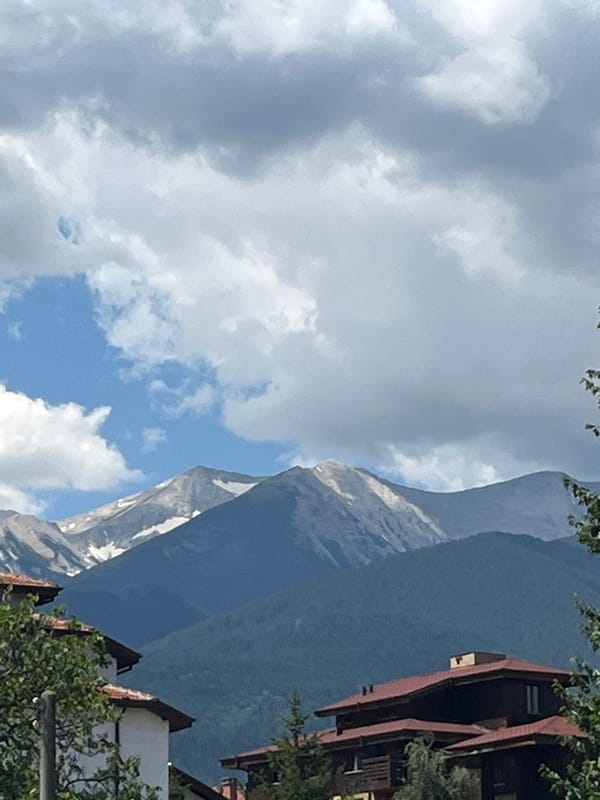Bansko streets, riverside cascades, and Pirin mountain views