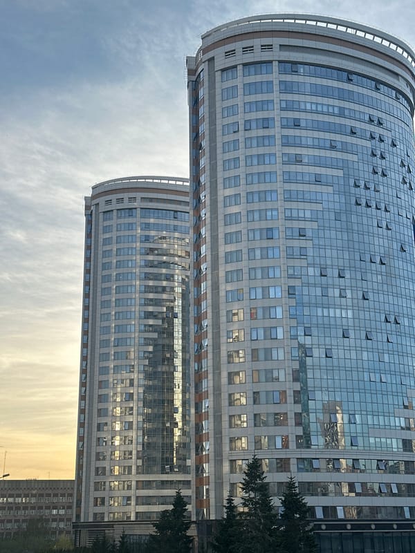 Modern curved buildings with open windows observed in Novosibirsk