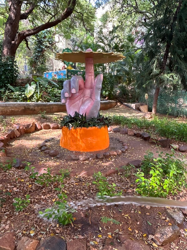 Visitor documents religious sites and street scenes in Puttaparthi