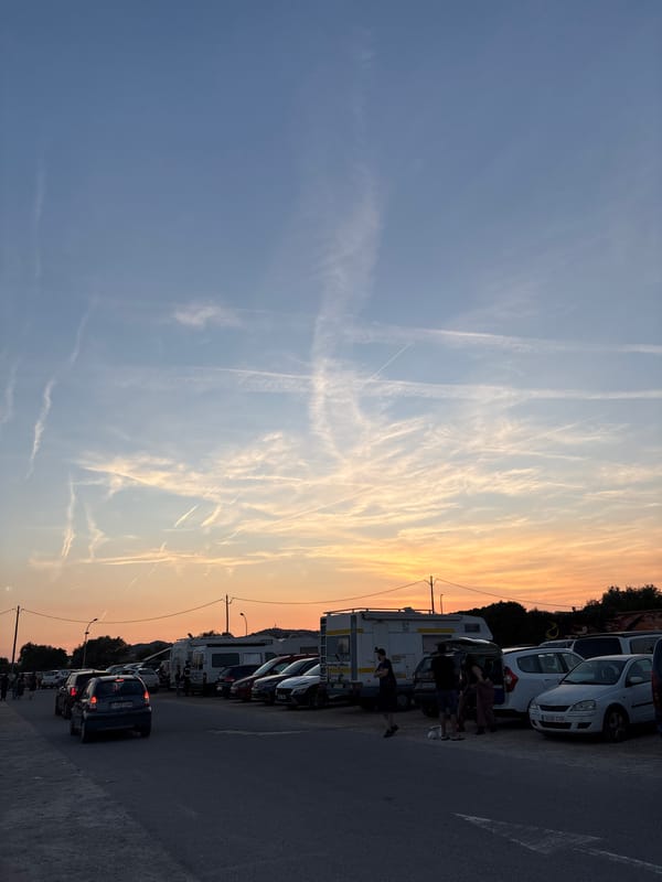 Evening gathering around vehicle in Cunit parking lot
