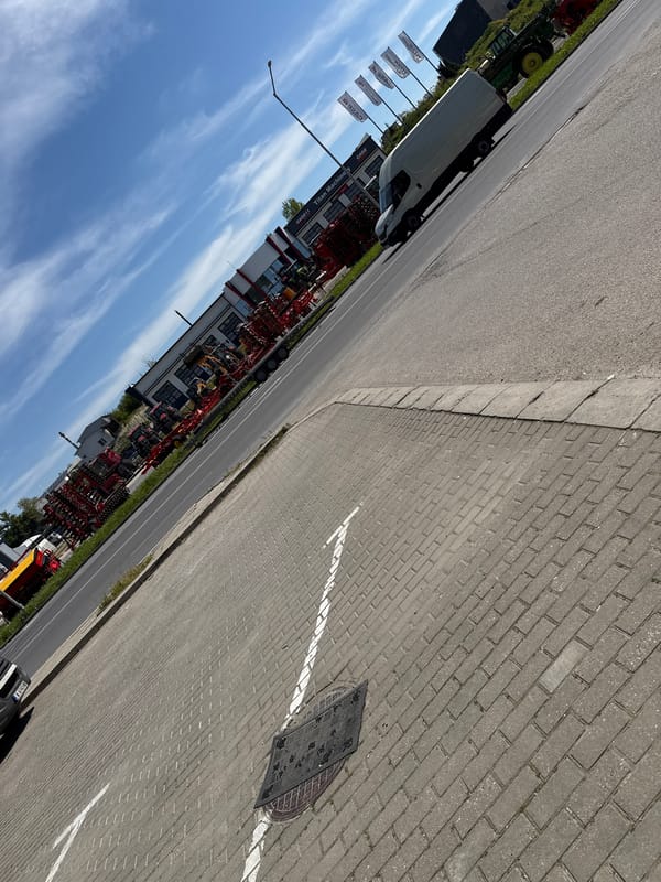 White van parked near farm equipment dealer in Shumen