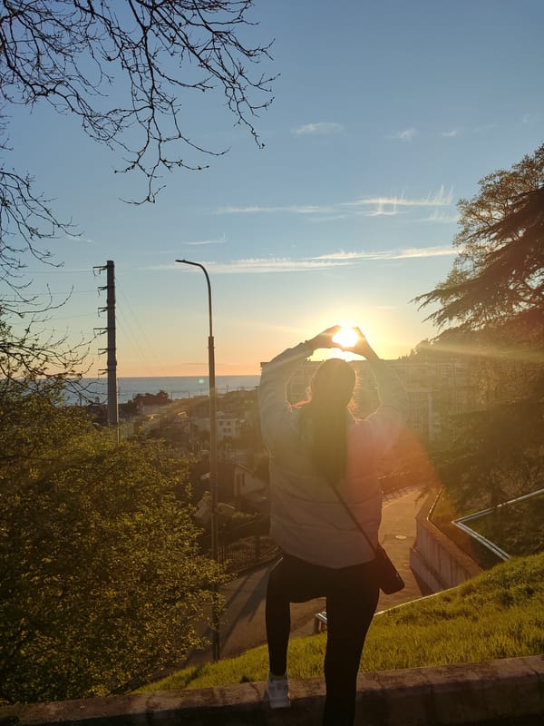 Heart gestures and urban sunset scenes captured across city