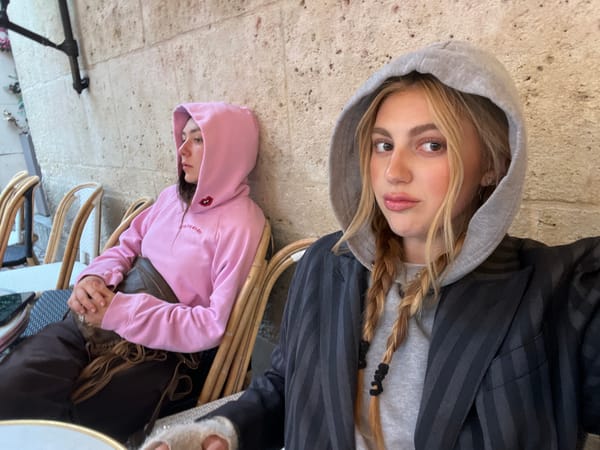Young woman documented at Paris cafe during rainy afternoon