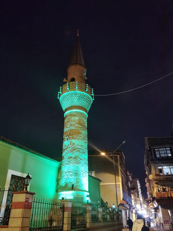 Green-lit minaret observed during Istanbul nighttime hours