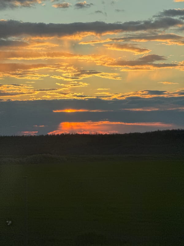 Dramatic sunset captured over rural Krasnaya Zarya, Russia