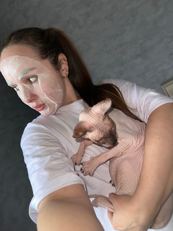 Woman documents morning skincare routine with pets in Ludorvay
