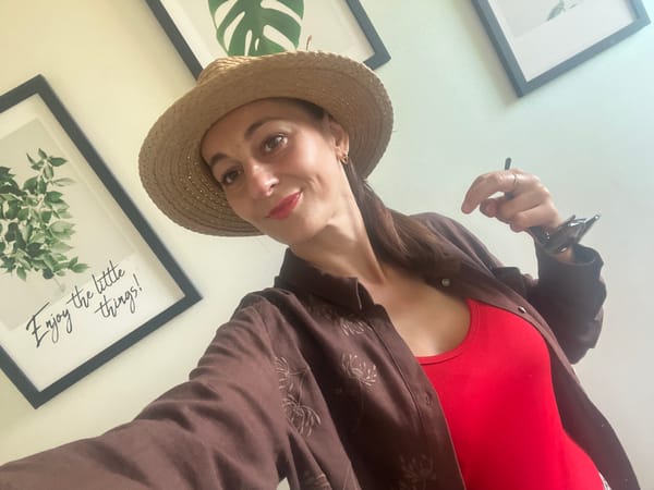 Indoor selfie session with a straw hat and layered outfit