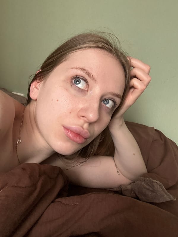 Woman and gray tabby cat share quiet morning moments